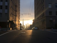 a city street with buildings in the background